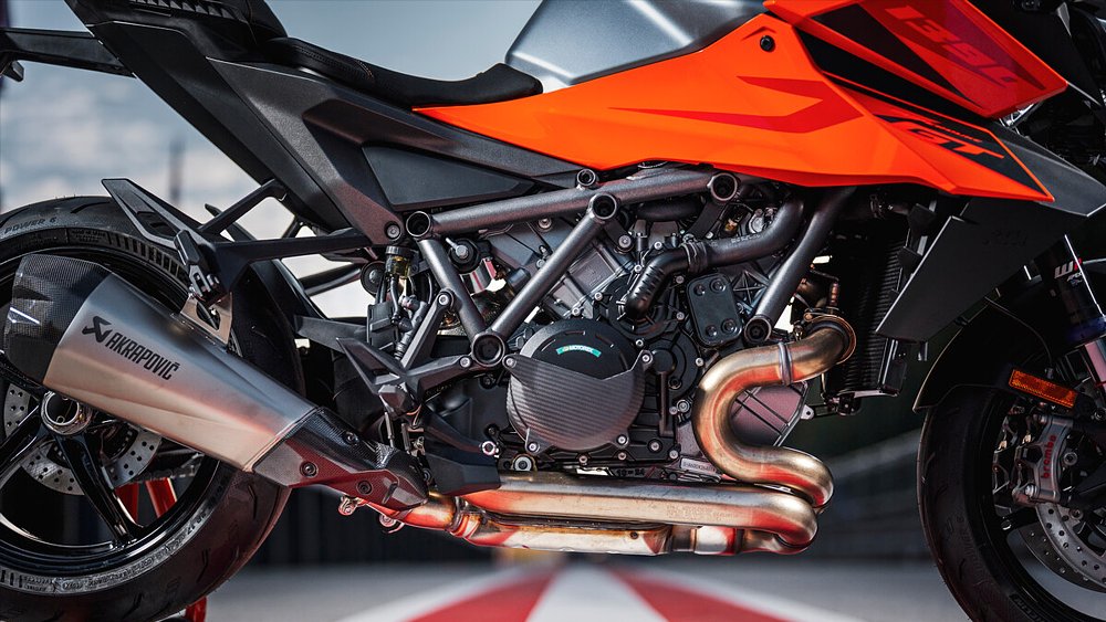 A close-up of the 2025 KTM 1390 Super Duke GT's 1,350 cc LC8 V-twin engine.