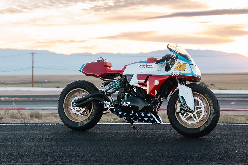 red, white, and blue cafe racer style motorcycle