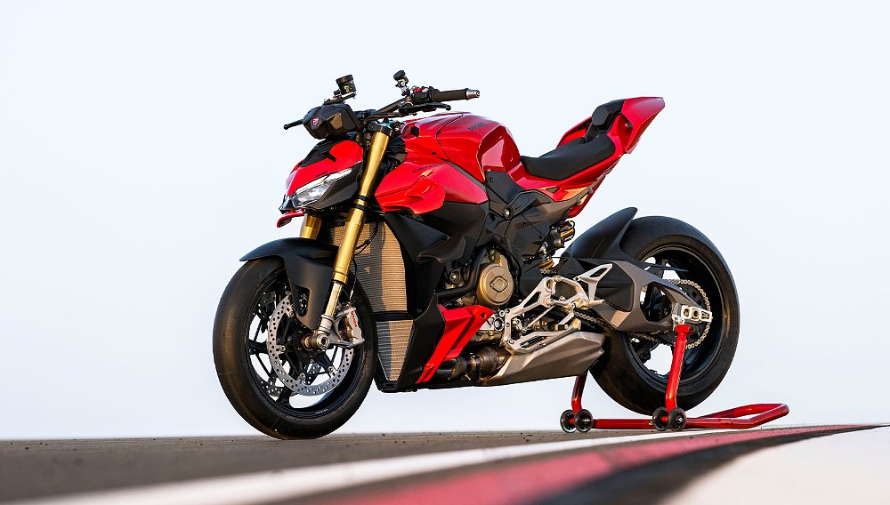 A 2025 Ducati Streetfighter V4 parked alongside the curbing of a racetrack. 