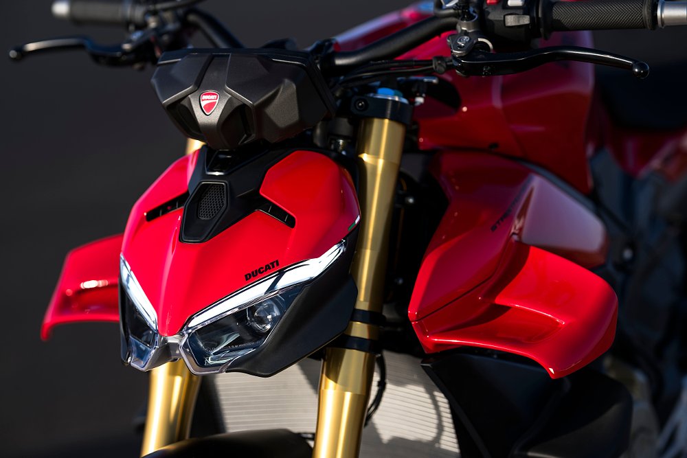 A close-up view of the 2025 Ducati Streetfighter V4's front headlight and aerodynamic winglets.
