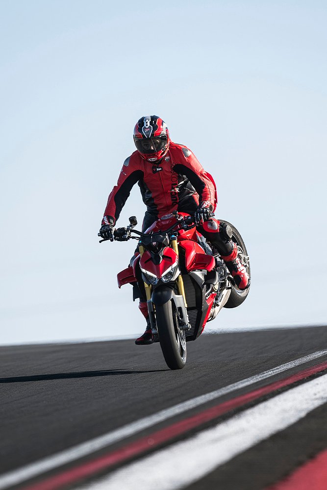A road racer performs a stoppie on the 2025 Ducati Streetfighter V4. 