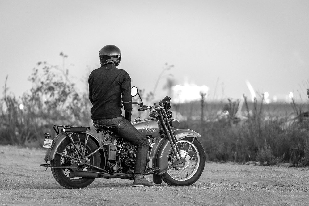1924 Harley-Davidson Model J parked overlooking Port of Los Angeles.