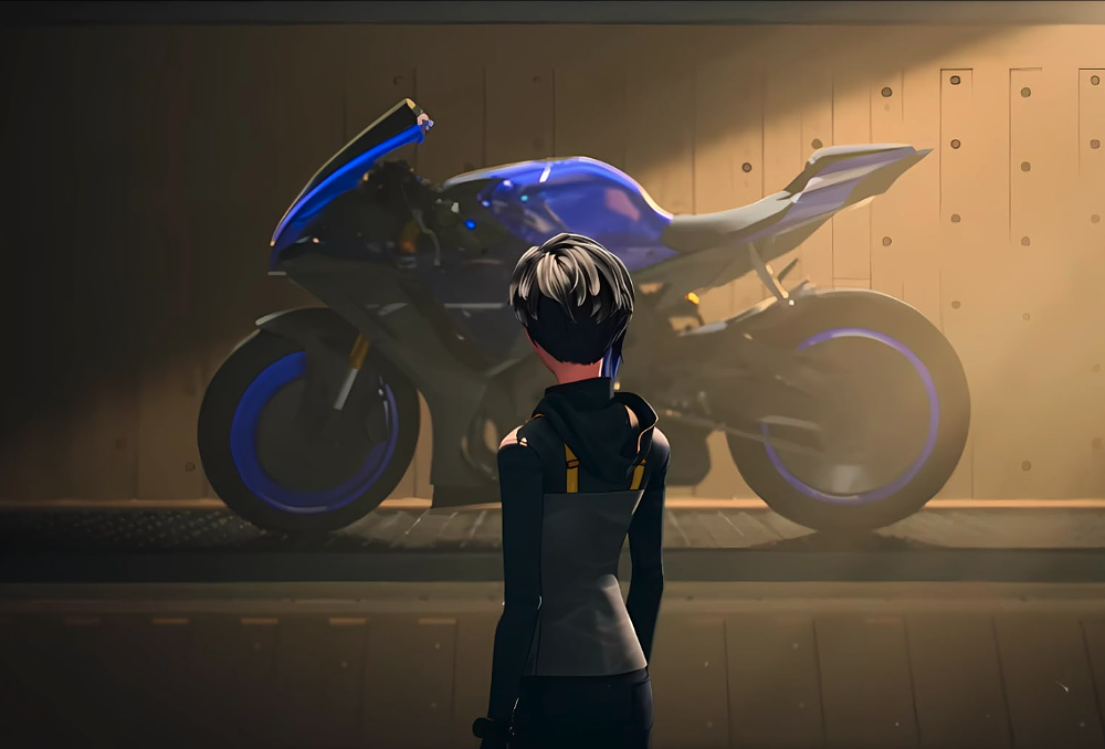 Kai stands before a Yamaha R1 super bike on a bike lift. 