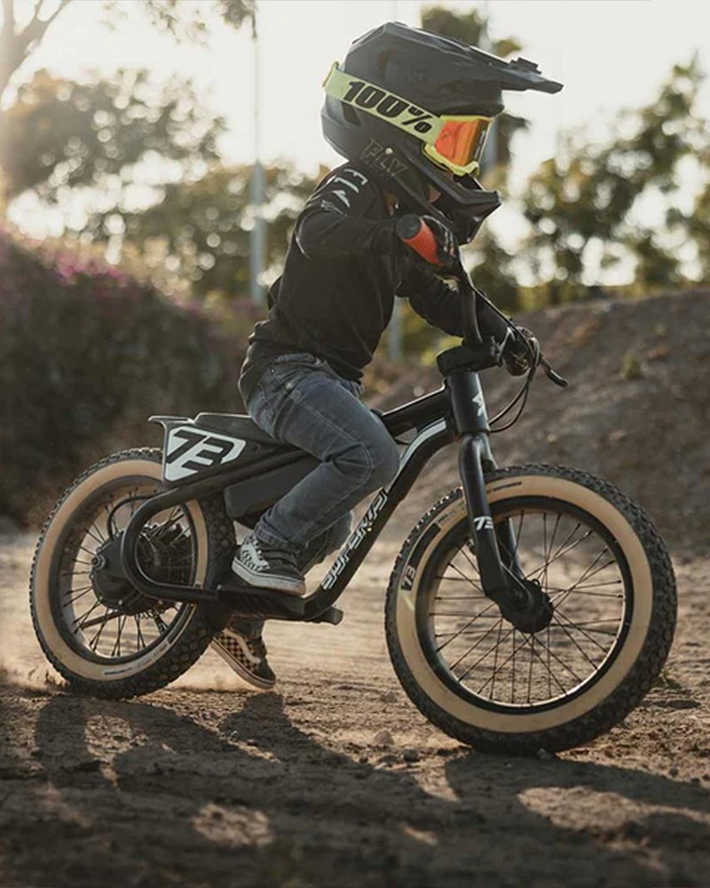 A child rides Super73's pedal-free electric balance bike, the K1D.