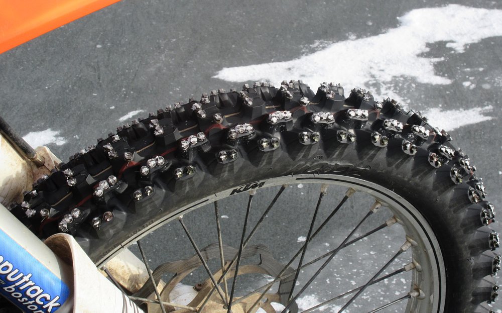 close view of studded front tire