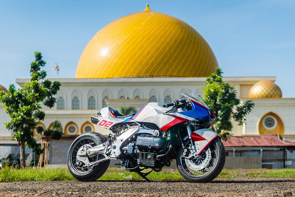 side view of the silver, blue, and red custom BMW