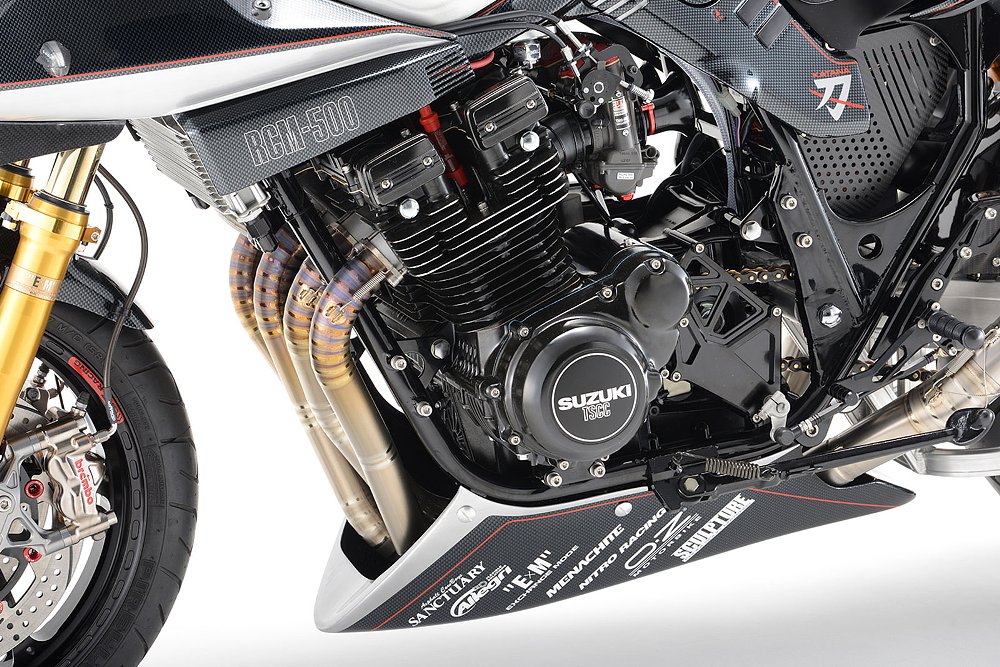 closeup of the four-cylinder engine with custom exhaust