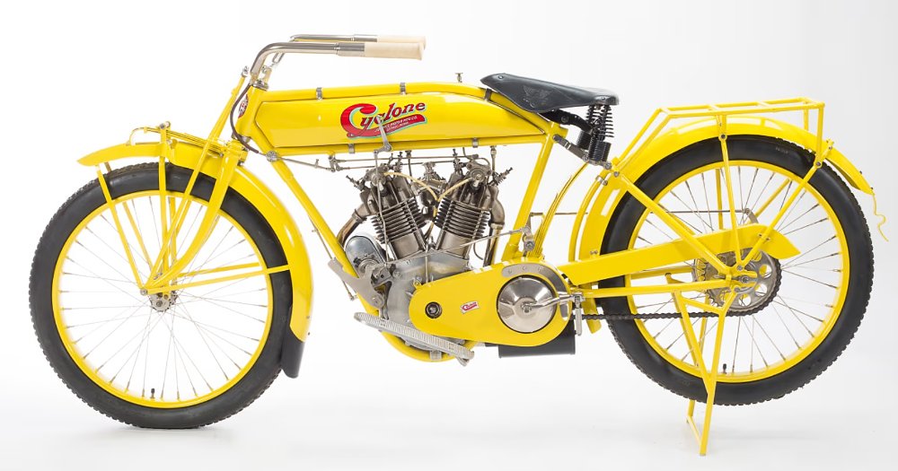 studio photo of a yellow Cyclone motorcycle from the early 20th century