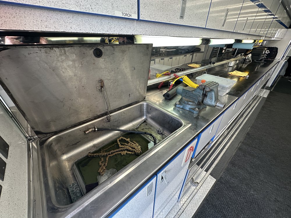 Suzuki SuperMotocross truck solvent tank work bench.