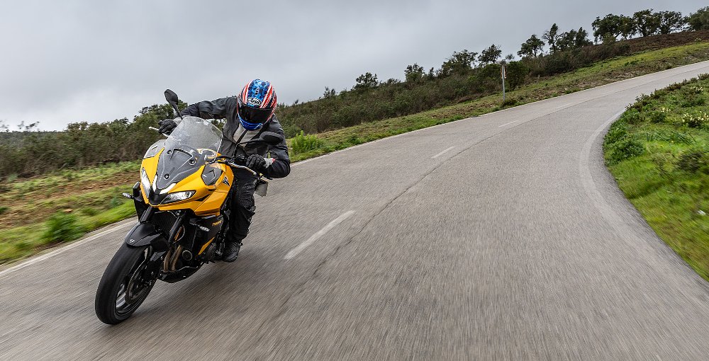 Dustin guides the Tiger Sport 800 through a sweeping curve.