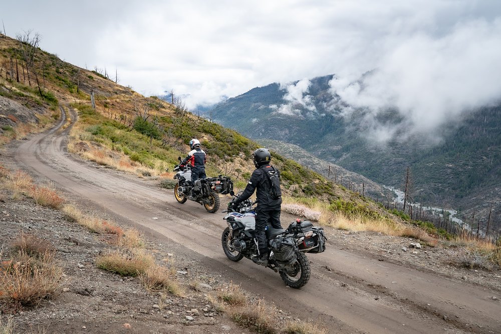 riders on two BMW GS models on a mountain trail