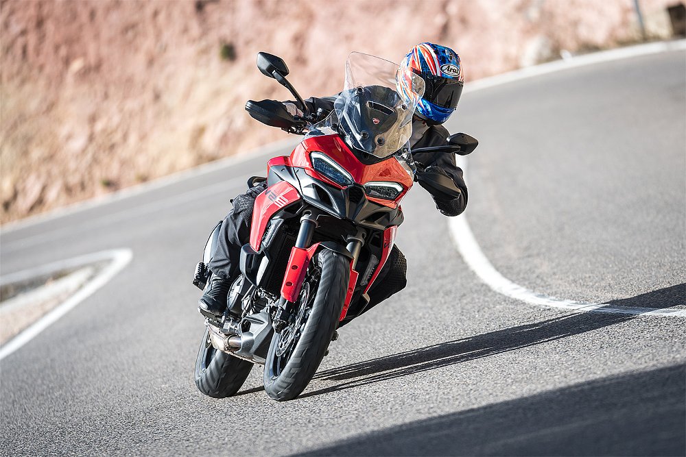 Dustin riding the Multistrada V2 S through an S-curve.