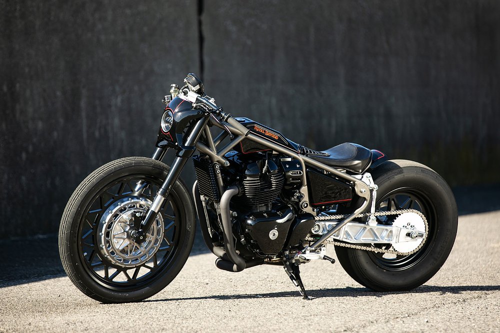 side view of the black, low-slung custom motorcycle