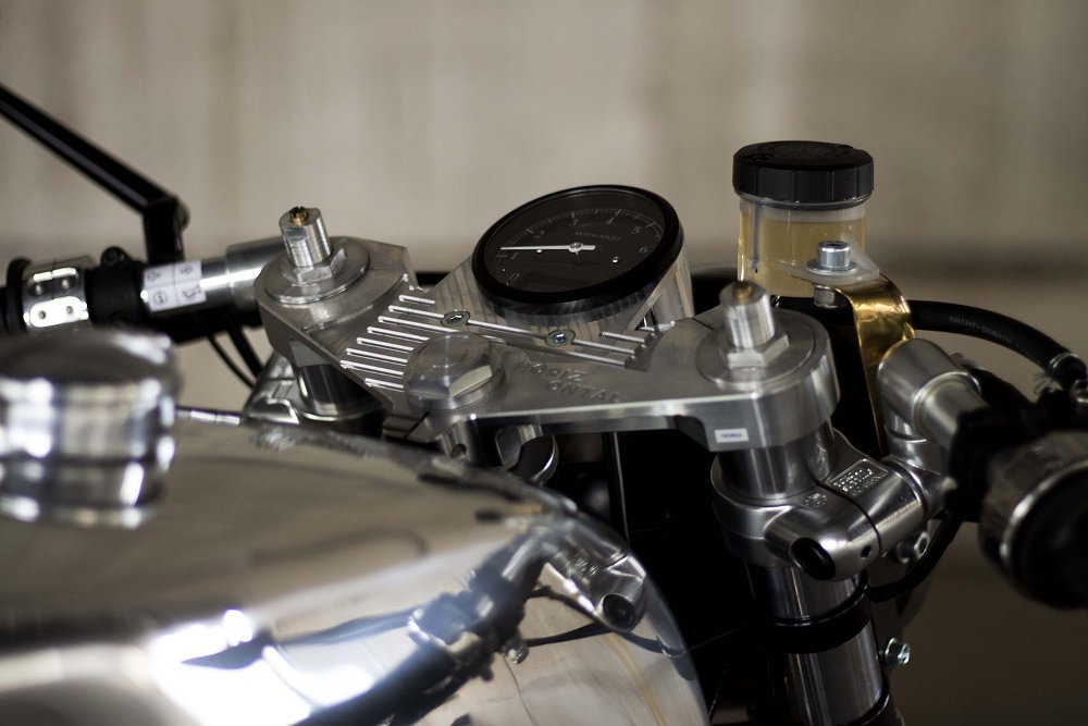 view of the top of the front fork with a single small round gauge