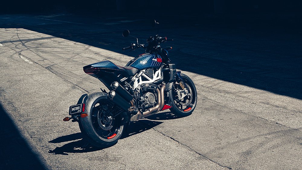 The FTR X 100% R Carbon stands in a single shaft of light.