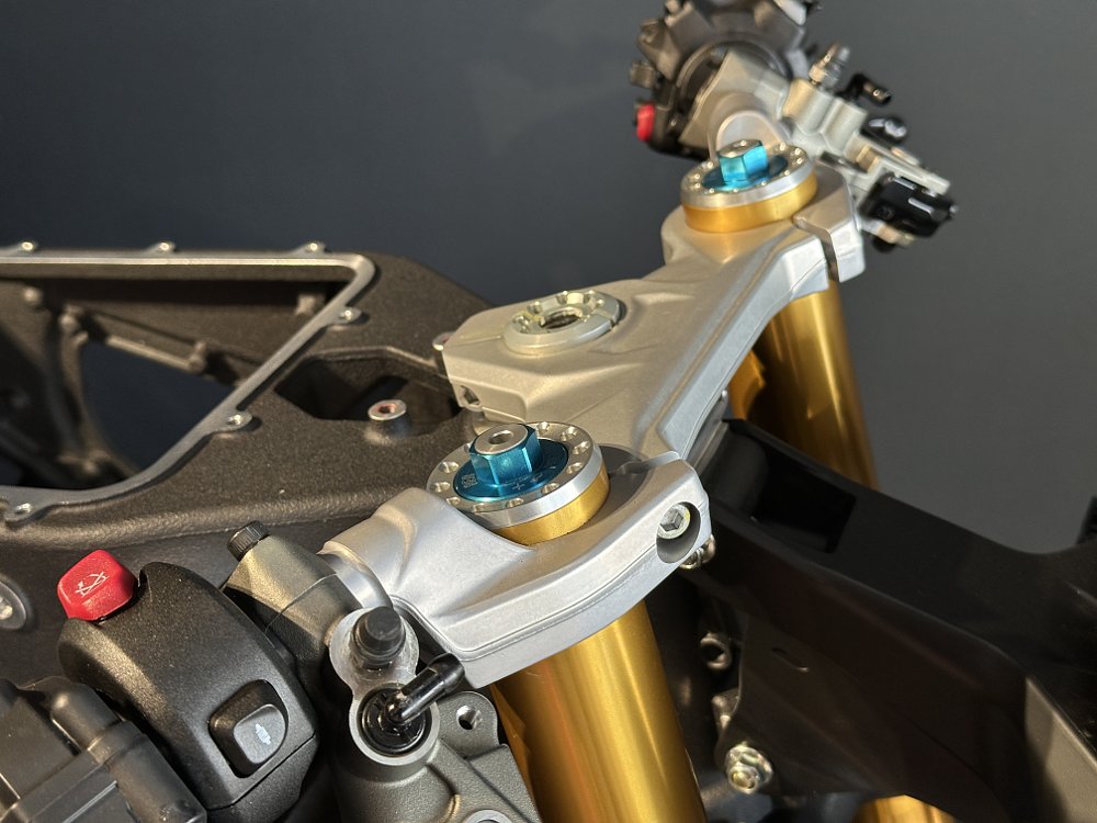 2025 Ducati Panigale V2 top triple-clamp and handlebar detail.