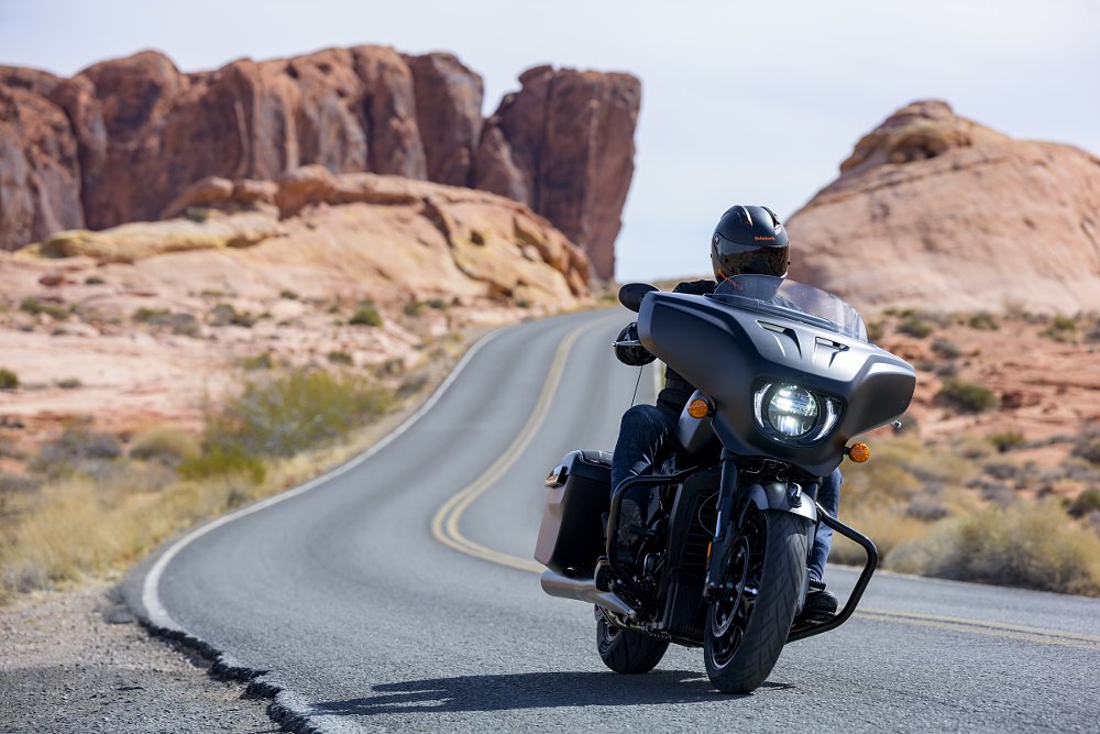 rider on the Chieftain PowerPlus on a two-lane road through red rock country