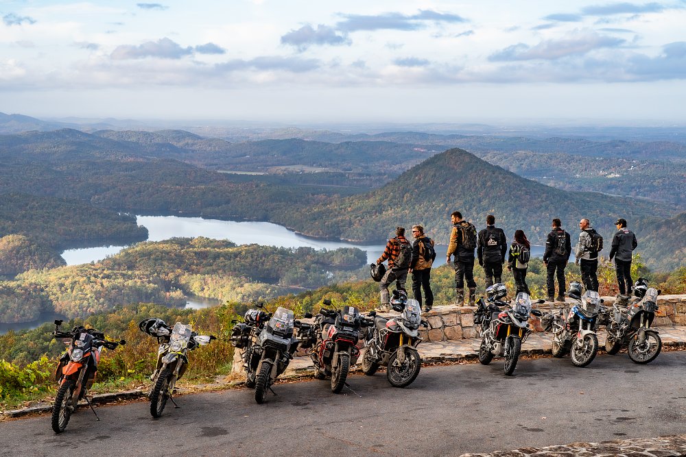 A group of riders surveying the Tennessee wildness from a mountain overlook.