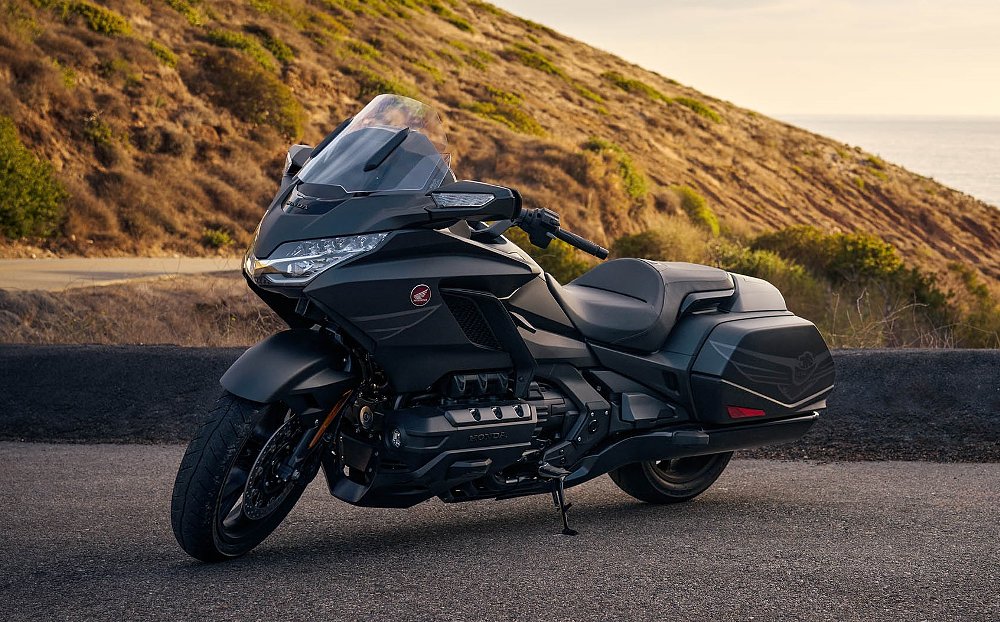 black 50th Anniversary Gold Wing base model parked on a mountain overlook