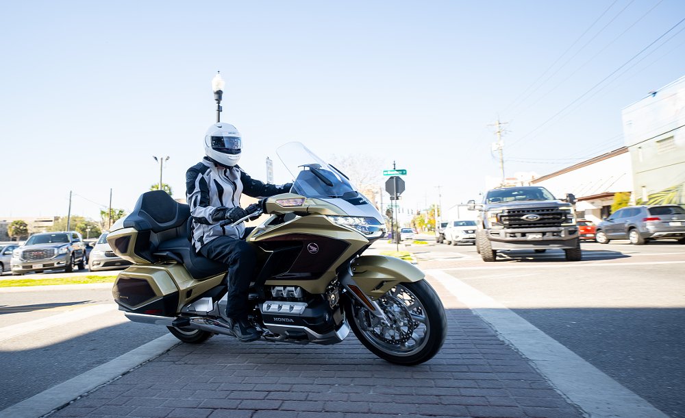 Honda Gold Wing turning at a city intersection
