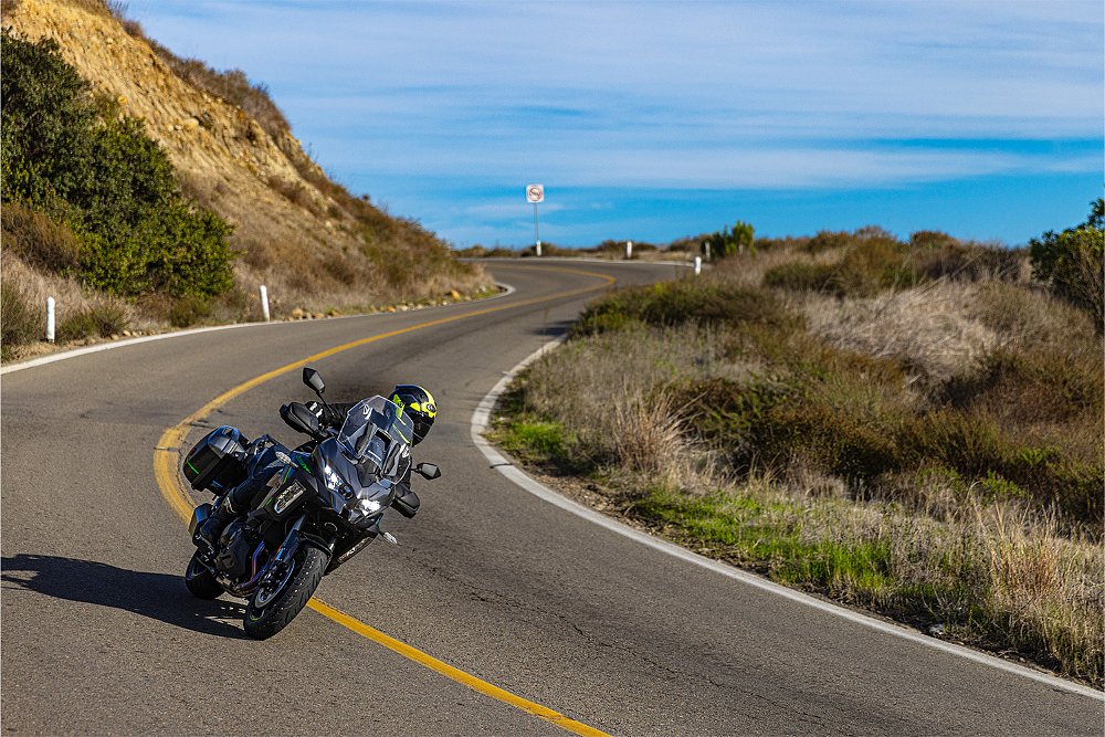 Dustin pilots the Versys 1100 through an mountainside S-curve.