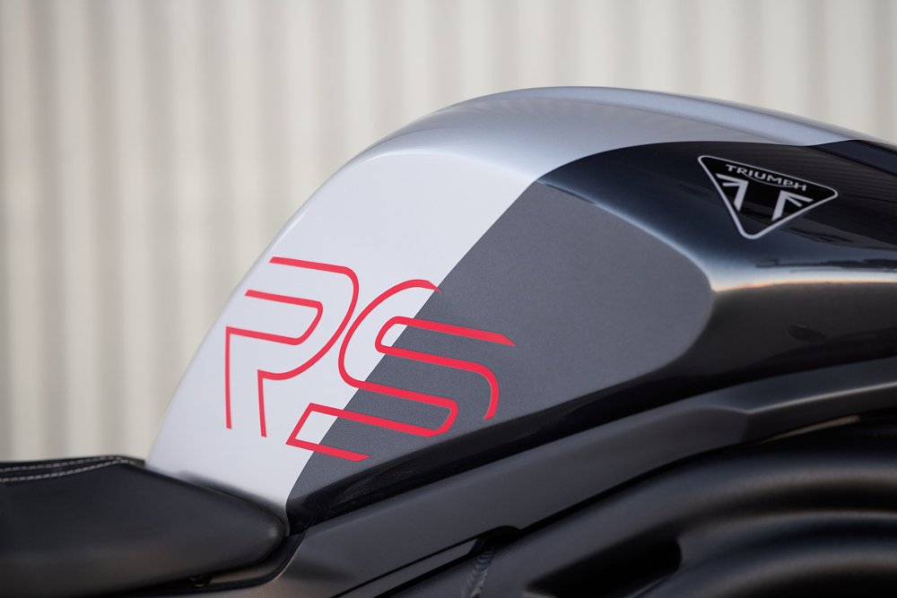 close view of silver-and-black tank with red accents