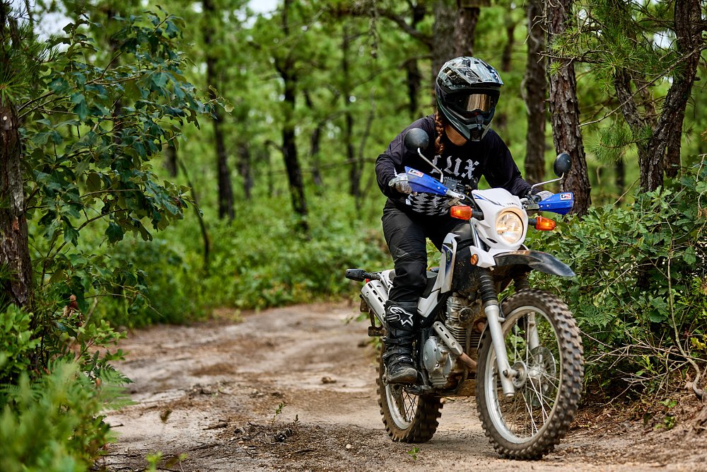 rider off-road on a trail in the woods