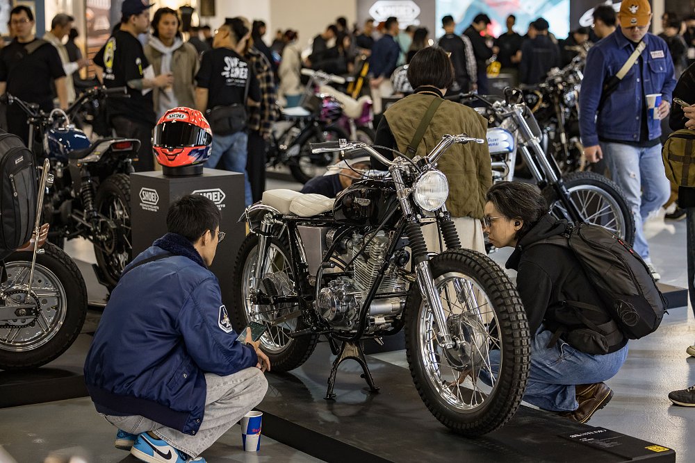 show visitor closely examining one of the customs on display