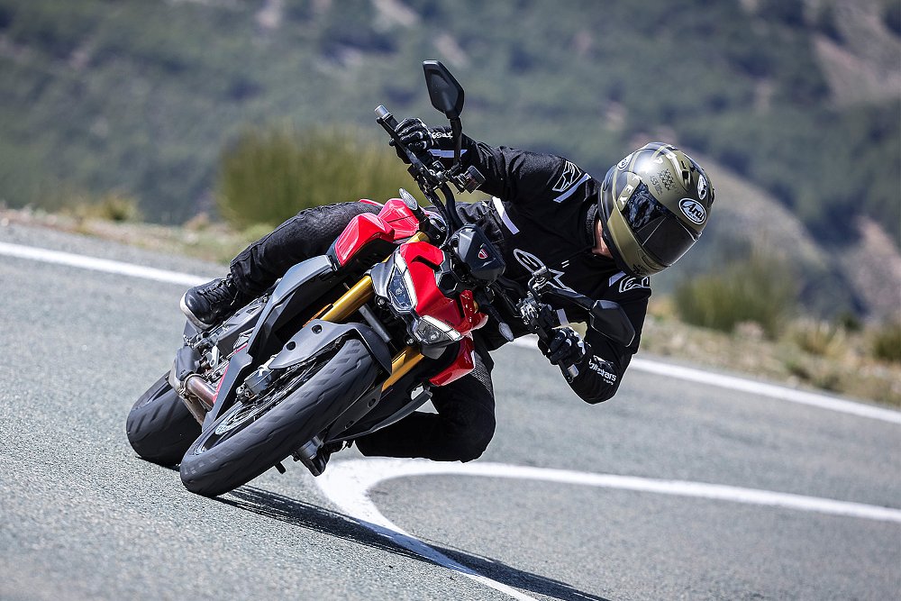 Dustin pilots the Streetfighter V2 S around a 90-degree turn.