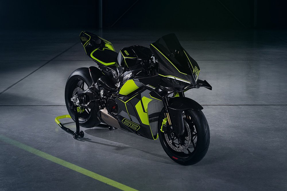 A front-right view of the 2026 Ducati Panigale V4 Lamborghini in a dimly lit garage.