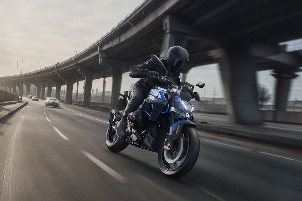 An A.I.-generated image of a BMW R 1300 R rider barreling down a highway.