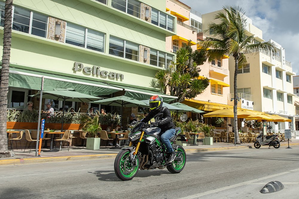 Dustin moseys down Miami's Ocean Dr., with Art Deco buildings in the background, aboard the 2025 Z900 SE.