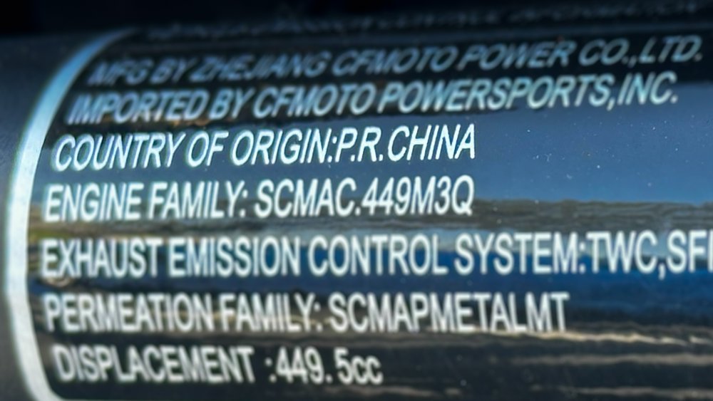 A close-up of the manufacturing badge found on the CFMOTO Ibex 450.