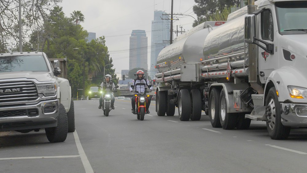 A Honda Grom and Zero S ride along a surface street in Los Angeles, CA.