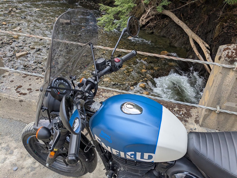 looking down on the blue and white gas tank of the Hunter and a stream below