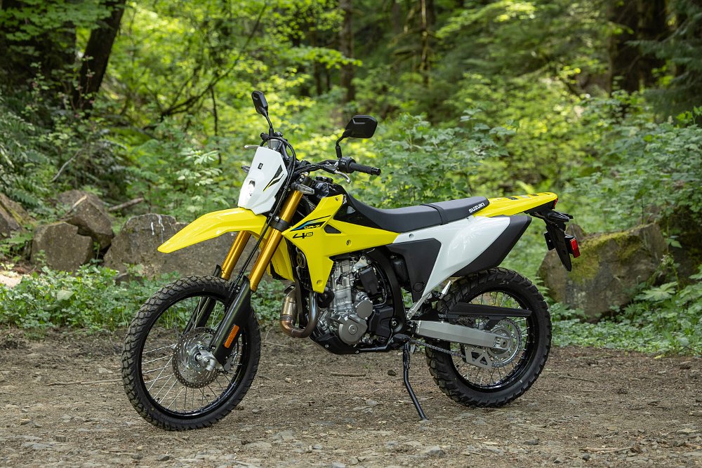 2025 Suzuki DR-Z4S left side, parked in a forest.