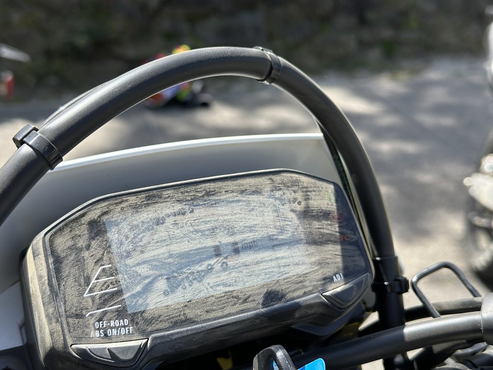 2025 Suzuki DR-Z4S LCD dash covered in dust.
