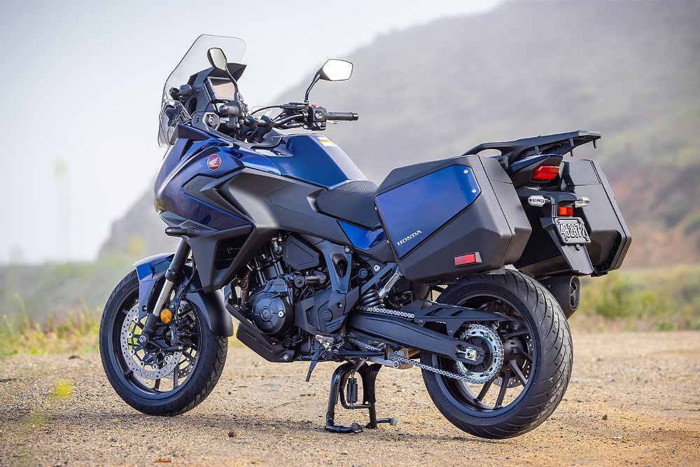 A left-rear view of the NT1100 DCT on a mountain road turnout.