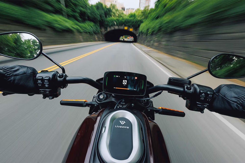 A rider's perspective from the cockpit of the LiveWire ONE traveling down the road.