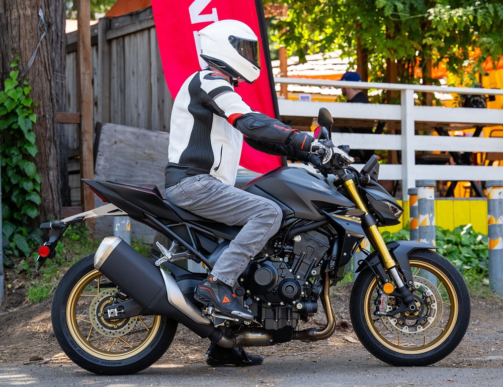 side view of the rider sitting on the Hornet to show the upright riding position