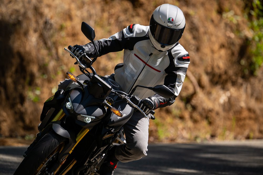 front view of a rider on the Hornet on a curving road