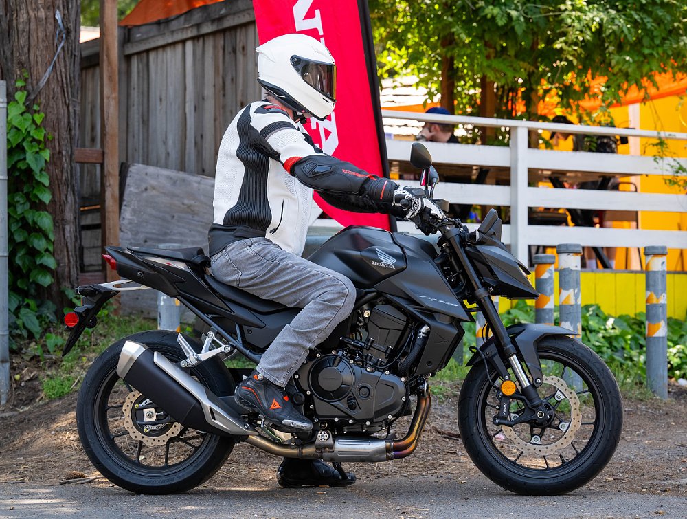 side view of a rider on the Hornet showing the upright riding position