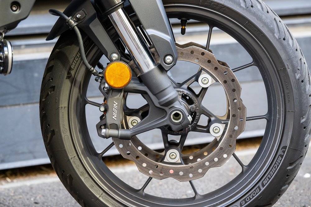 close view of the front wheel, suspension and brakes