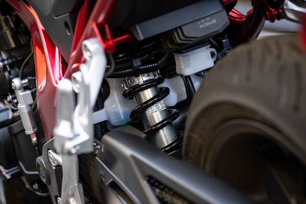 view showing the rear shock absorber deep inside the motorcycle in front of the rear wheel