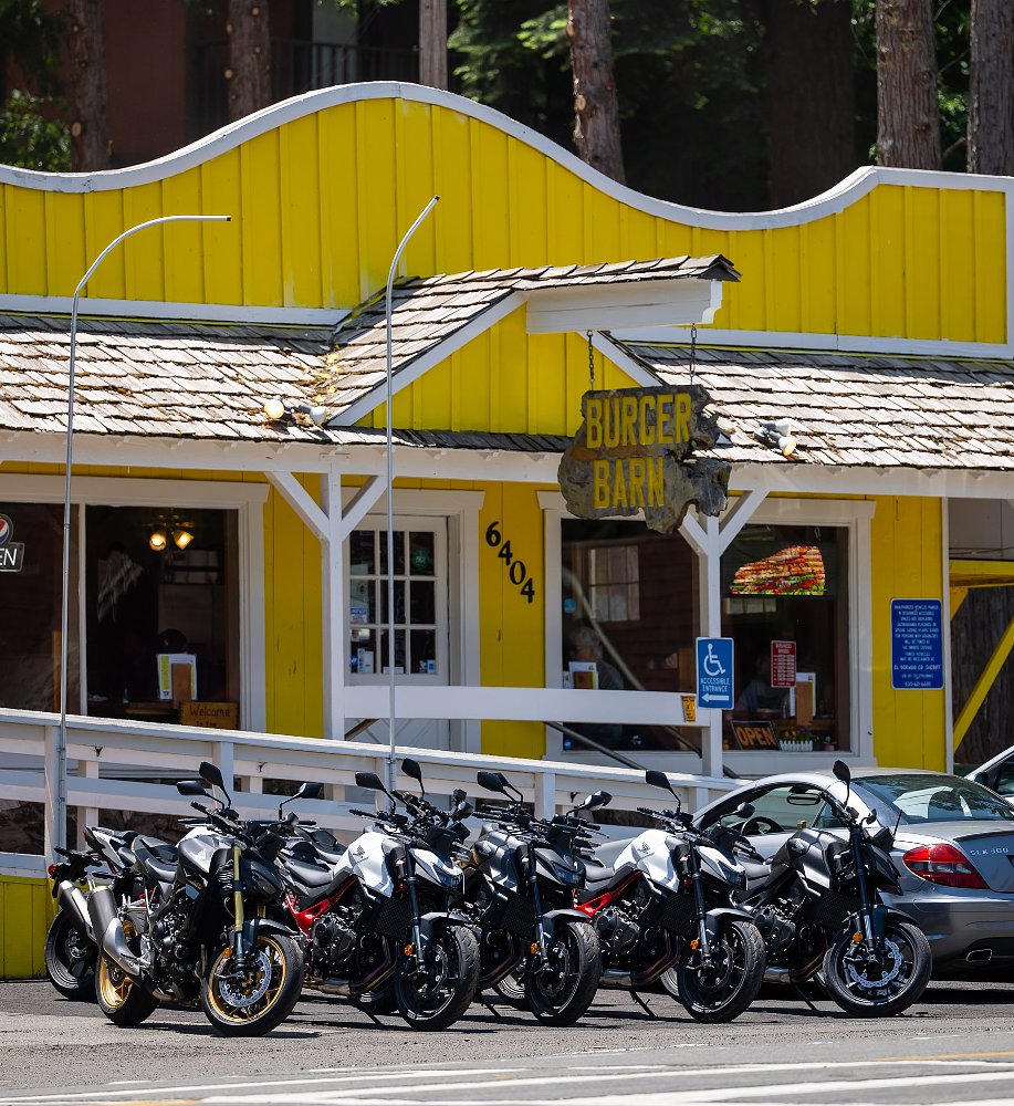 group of Hornets parked in front of a yellow small-town restaurant