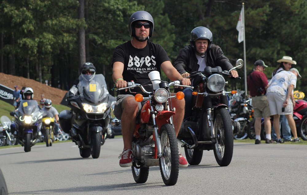 riders on vintage motorcycles at the festival