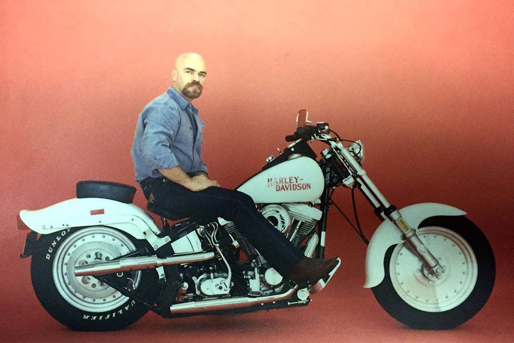 Harley-Davidson Montreal general manager Duc Dufour sits on the original Lowboy concept.