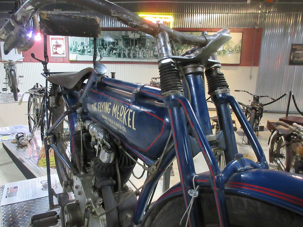 close view of the front suspension of a blue Flying Merkel motorcycle