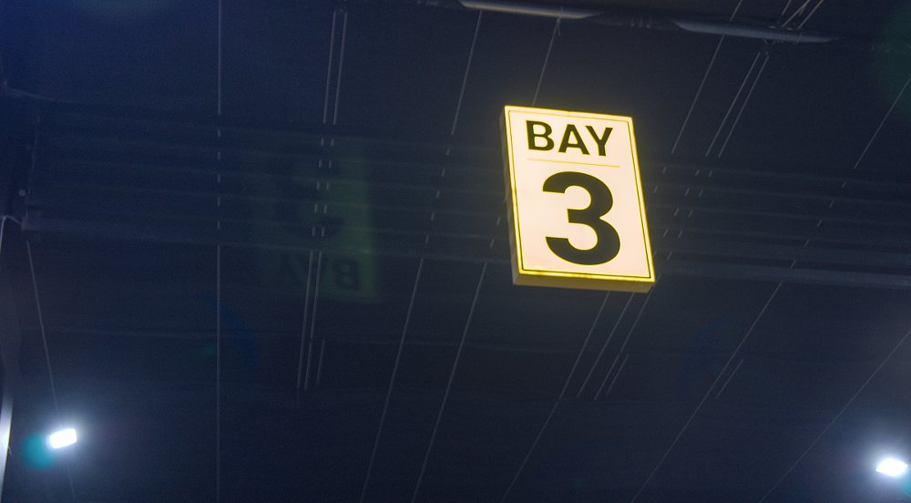 yellow Bay 3 sign glowing in the fog