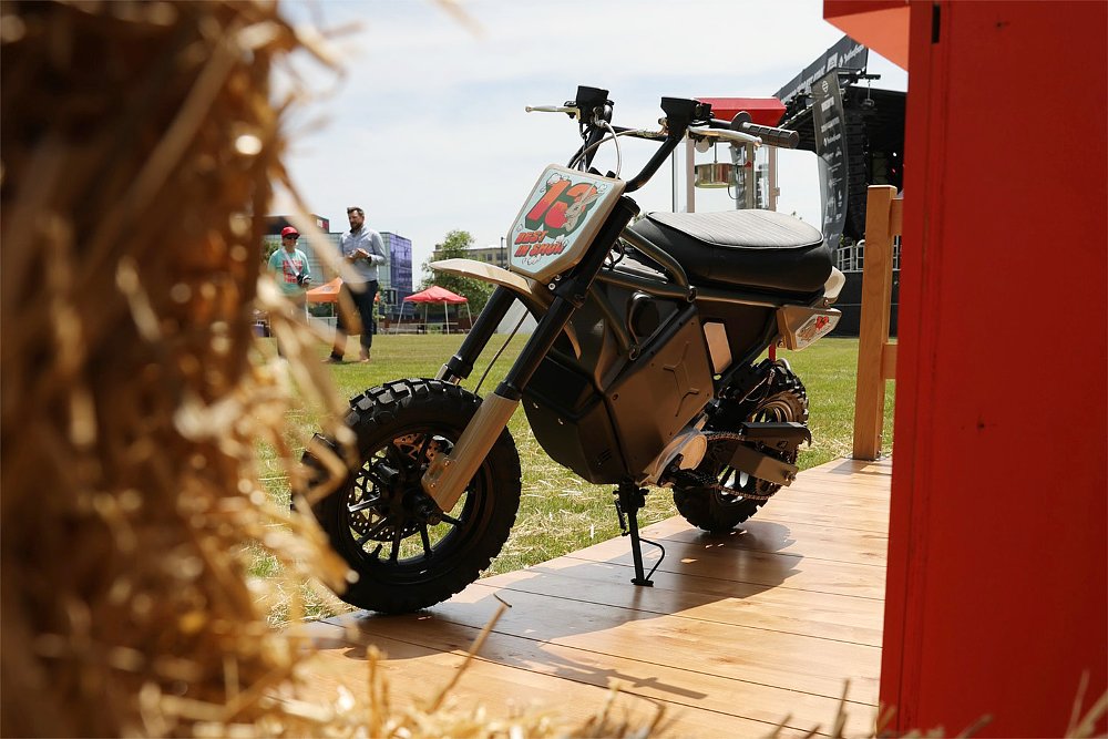 LiveWire's electric mini moto concept pictured behind a hay bale.
